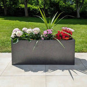 Rows of long planters filled with vibrant flora.